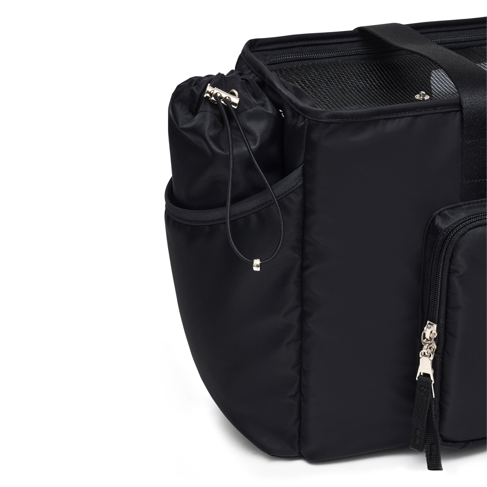 A close-up studio detail shot of the side profile of the black Merlot Mermer dog carrier bag, showcasing the durable mesh window panel, a zippered pocket with premium silver hardware, and a practical drawstring utility pouch.