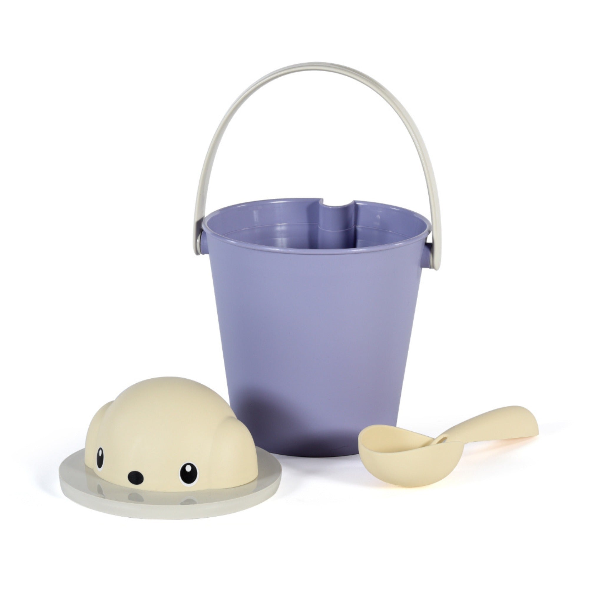 A studio shot of the disassembled Crock dog dry food container set, showcasing the periwinkle purple storage bucket with a light grey handle, a cream dog-shaped head lid, and a matching cream plastic food scoop.