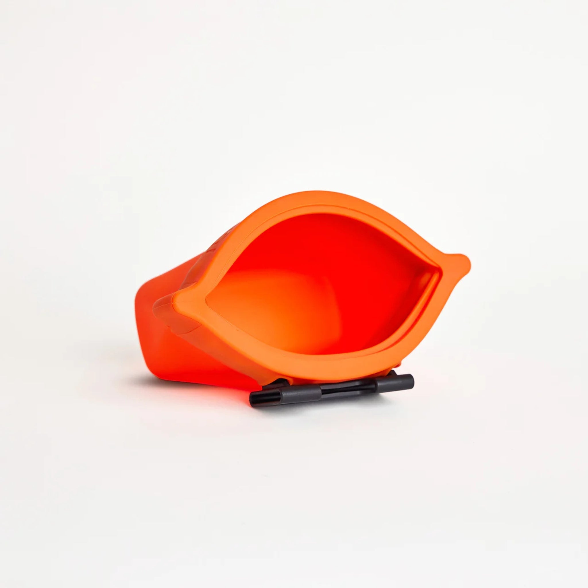 An open clementine orange silicone dog treat pouch, the Ultimate Treat Pouch The Standard by Voilapets, showing its wide mouth opening and black belt clip underneath.