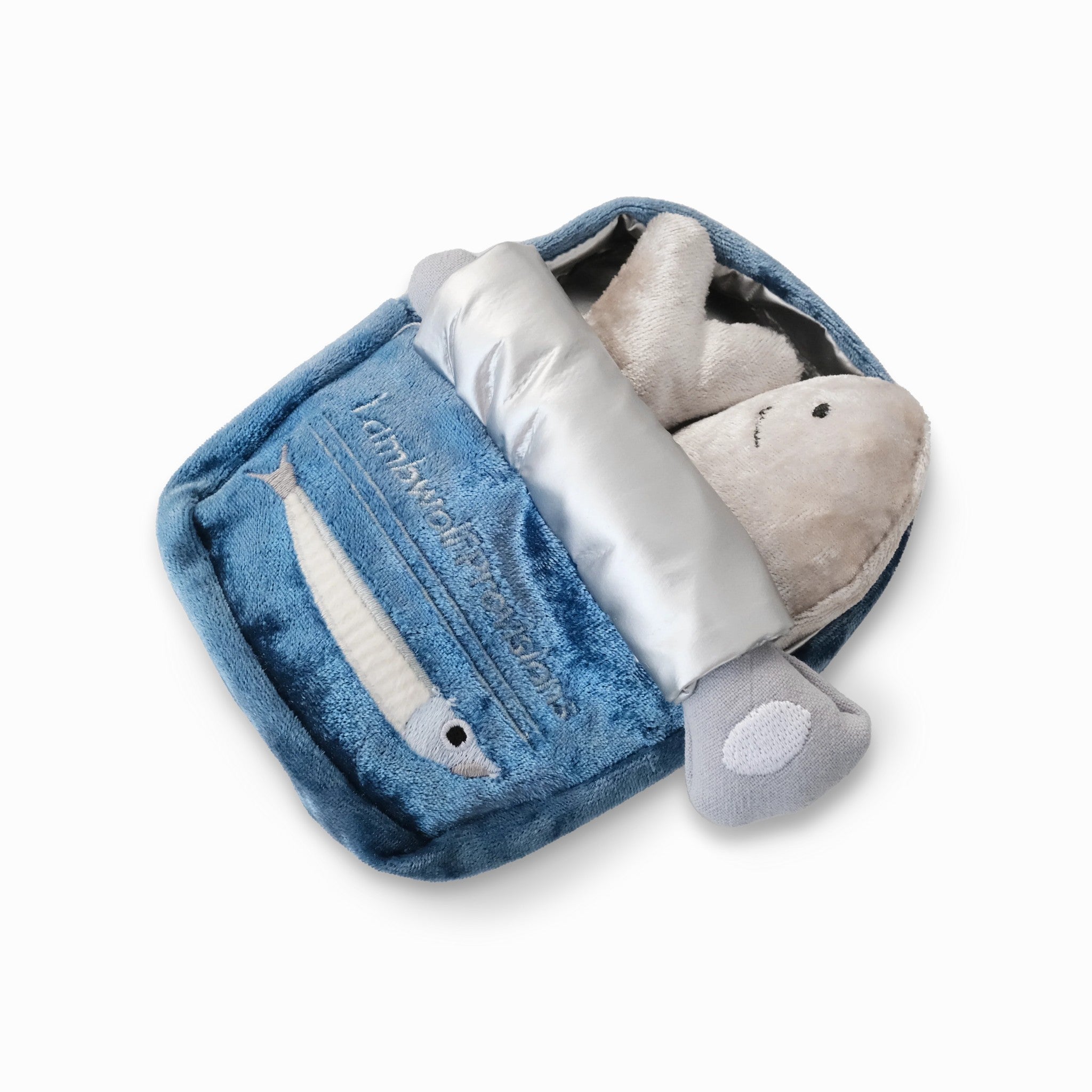 Studio product shot of the Kitty Sardines plush cat toy set, featuring two small velvet fish nestled inside an interactive, deep blue crinkle tin pouch with a silver metallic pull-tab lid.