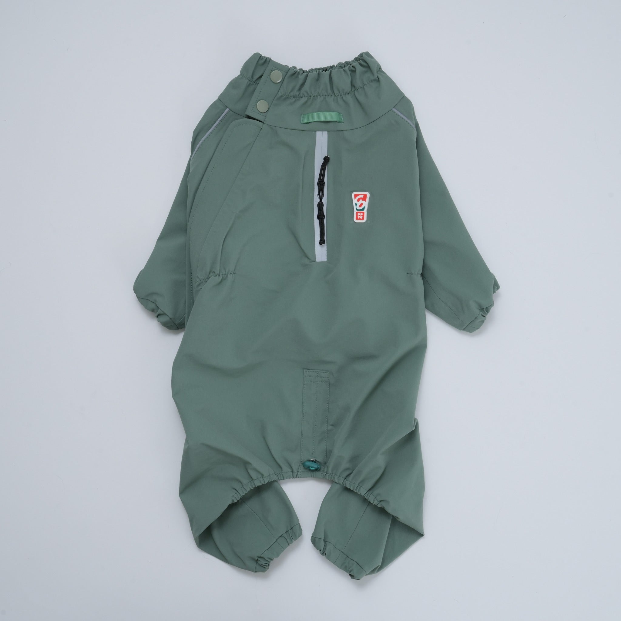Studio front-view flat lay of the khaki green Puppy Gallery Go Pro Weather Suit, showcasing the high snap collar, elastic waist, and waterproof chest zipper.