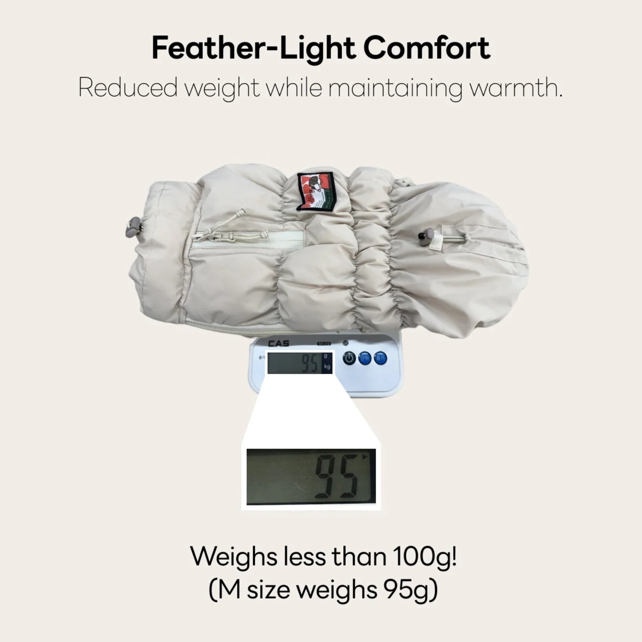 A product weight demonstration graphic showing a medium-sized beige Kiroro Cloud Padding dog vest on a digital scale weighing exactly 95 grams, highlighting its feather-light winter warmth comfort.