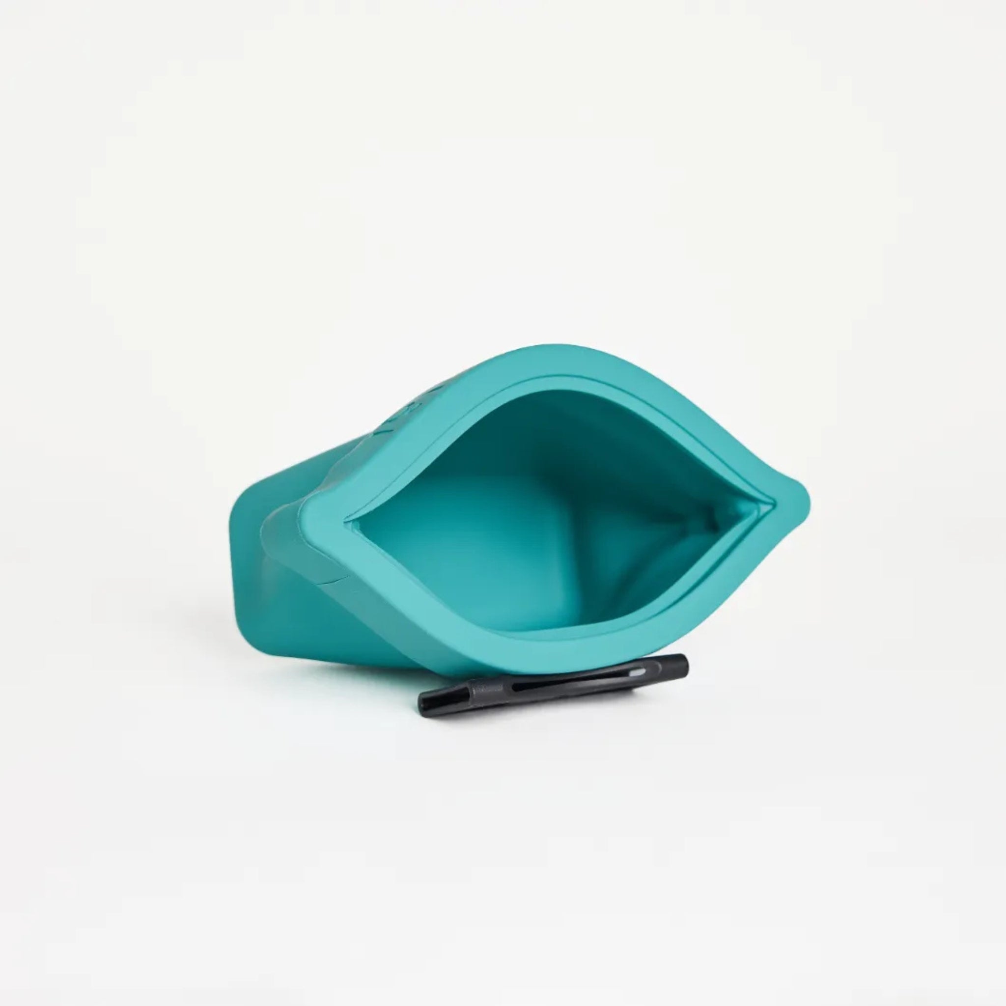 An open cyan blue silicone dog treat pouch, the Ultimate Treat Pouch The Mini by Voilapets, showing its wide mouth opening and black belt clip underneath.