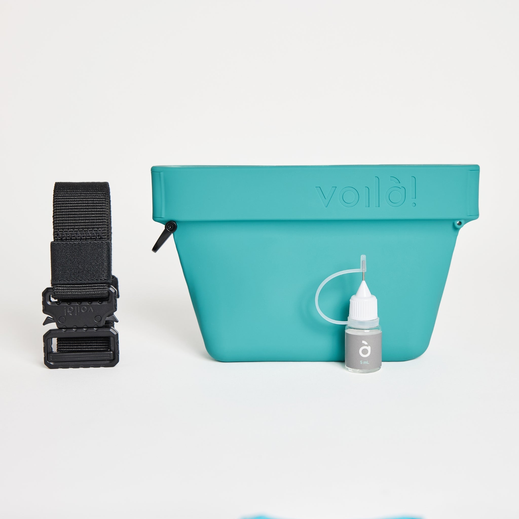 The complete cyan blue Voilapets Ultimate Treat Pouch The Mini set, including the silicone training pouch, heavy-duty black tactical belt buckle, and a small maintenance oil bottle.