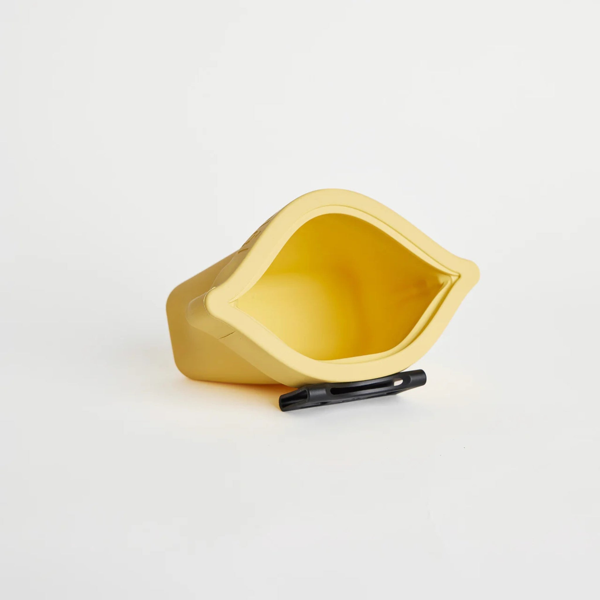 An open sunflower yellow silicone dog treat pouch, the Ultimate Treat Pouch The Mini by Voilapets, showing its wide hinge mouth opening and a black belt clip underneath.