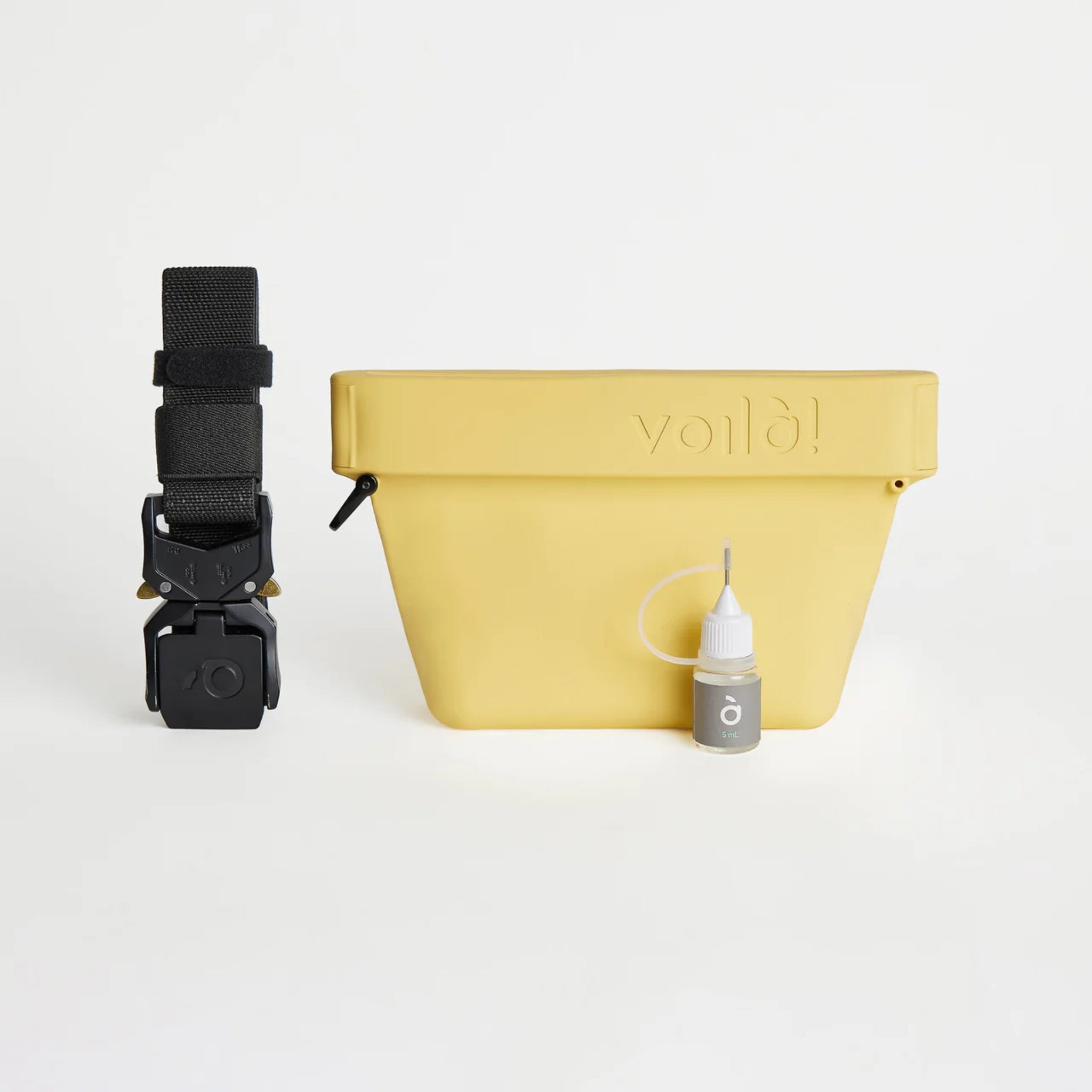 The complete sunflower yellow Voilapets Ultimate Treat Pouch The Mini set, including the silicone training pouch, a heavy-duty black tactical belt buckle, and a maintenance oil bottle.