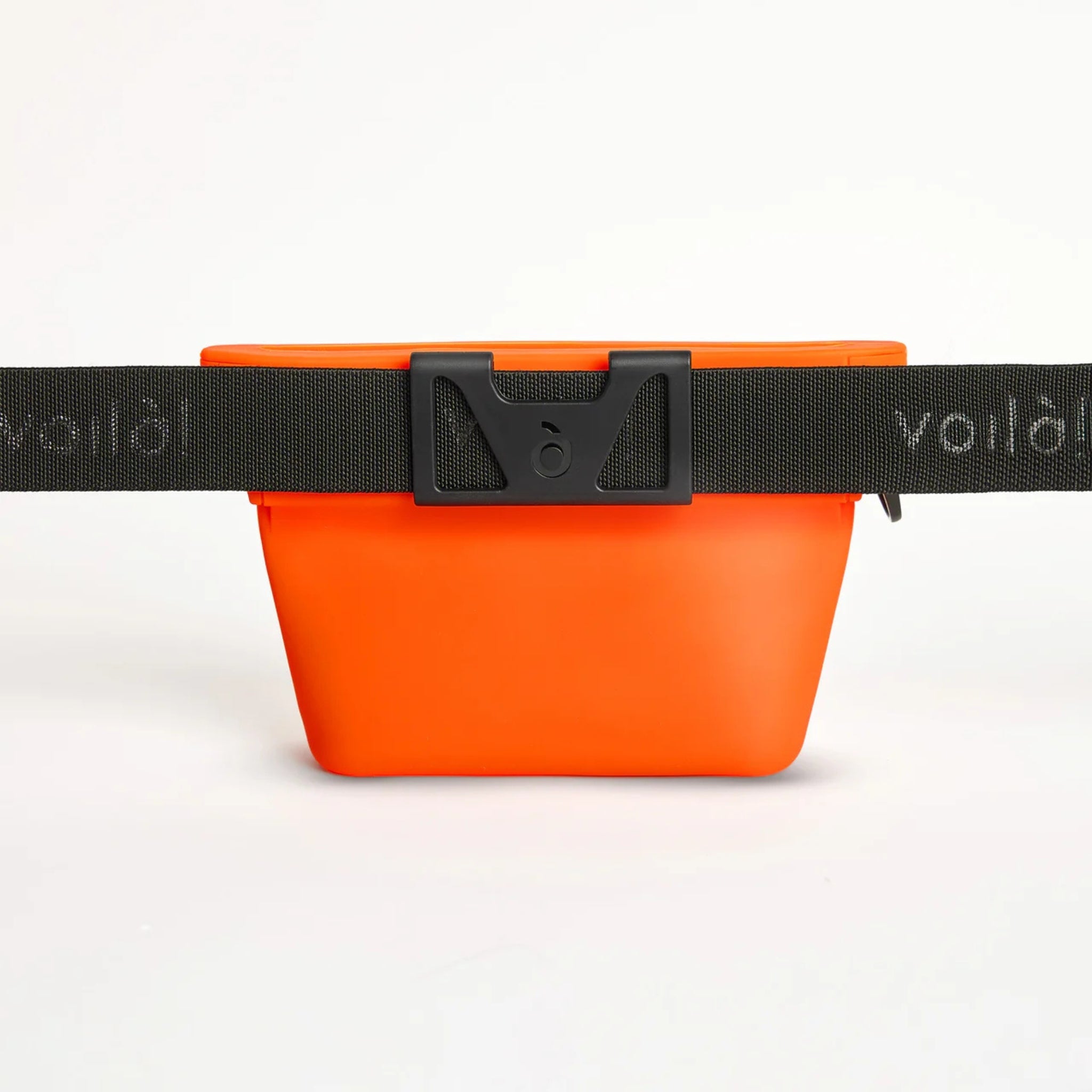 Rear view of the clementine orange Ultimate Treat Pouch The Standard by Voilapets, secured to an adjustable black nylon dog training waist belt.