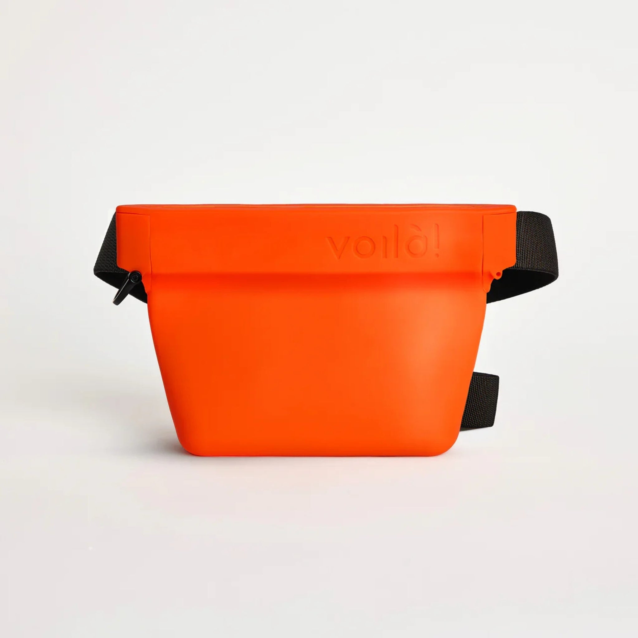 Front view of the clementine orange Voilapets Ultimate Treat Pouch The Standard, showcasing the sleek silicone design with the embossed brand logo on the upper rim.
